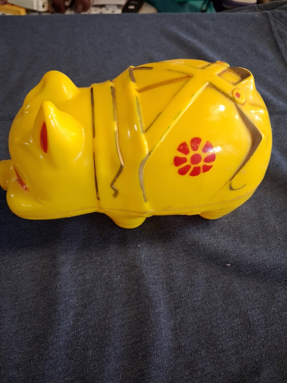 Yellow vintage plastic piggy bank from 1960s